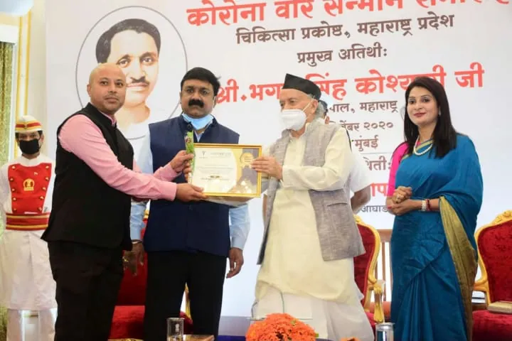Corona Warrior honour. Dr. Bhalchandra Thakare receiving the citation from Governor Bhagat Singh Koshyari, Mumbai, December 2020