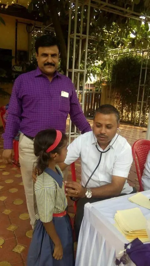 School health check up. A student being examined at a school camp