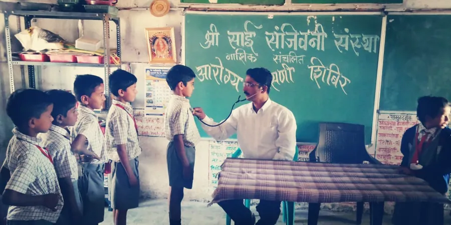 Aarogya Tapasni Shibir at a village school. Students screened one by one in the classroom